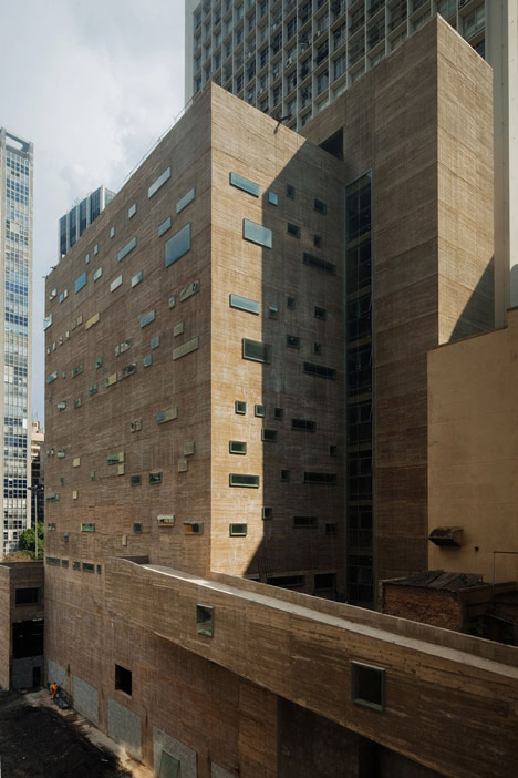 Praca das Artes by Brasil Arquitetura features concrete boxes projecting over a public plaza