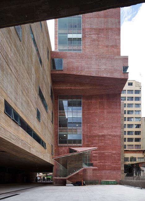 Praca das Artes by Brasil Arquitetura features concrete boxes projecting over a public plaza