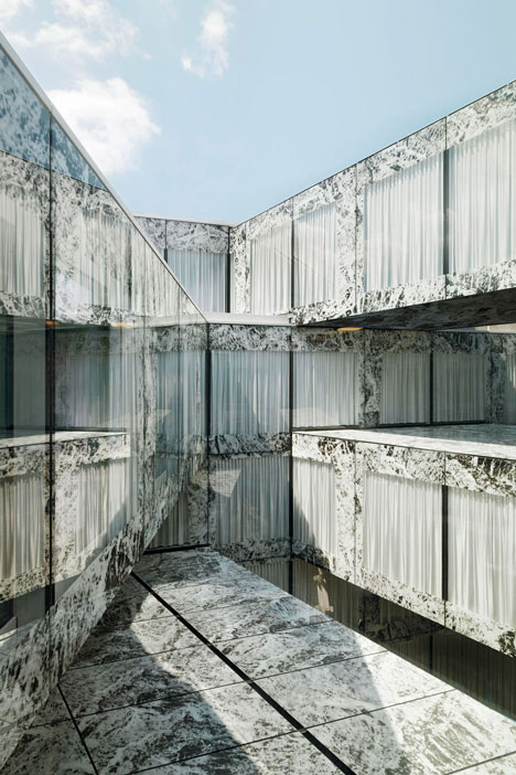 Allianz Headquarters by Wiel Arets features glass fritted to resemble Mies' Barcelona Pavilion