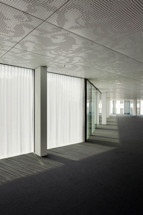 Allianz Headquarters by Wiel Arets features glass fritted to resemble Mies' Barcelona Pavilion