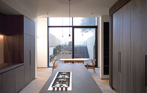 Curvacious oak staircase ascends through converted London convent by John Smart Architects