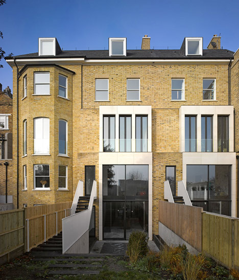 Curvacious oak staircase ascends through converted London convent by John Smart Architects