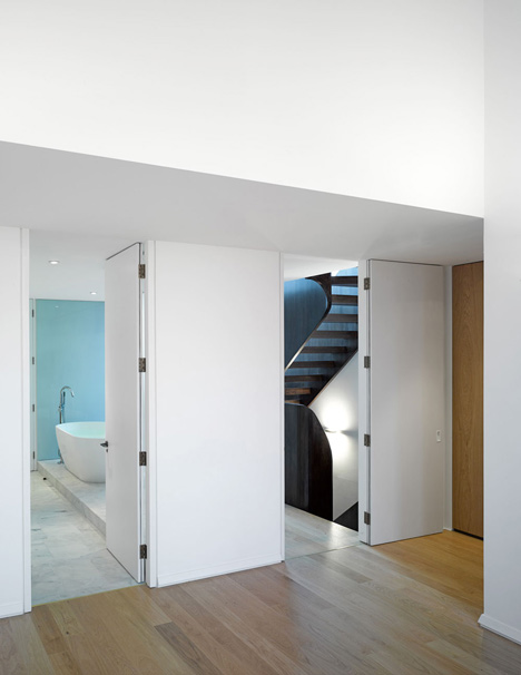 Curvacious oak staircase ascends through converted London convent by John Smart Architects