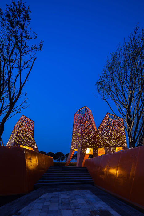 Four-legged perforated metal pavilions rise above Fengming Mountain Park