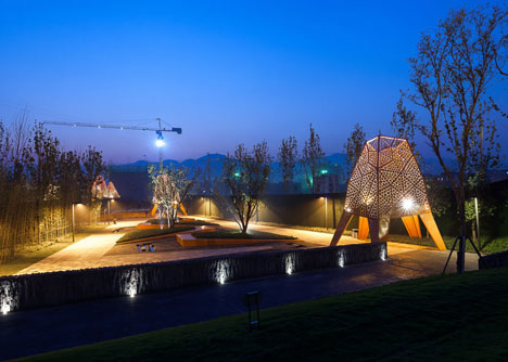 Four-legged perforated metal pavilions rise above Fengming Mountain Park