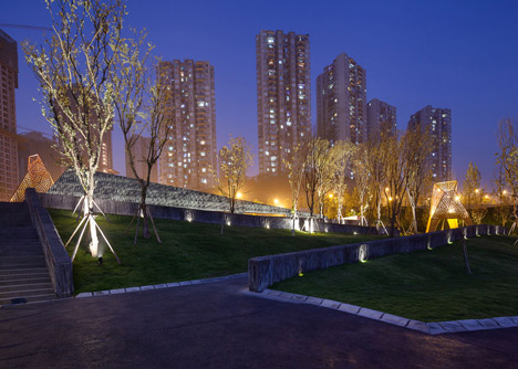 Four-legged perforated metal pavilions rise above Fengming Mountain Park