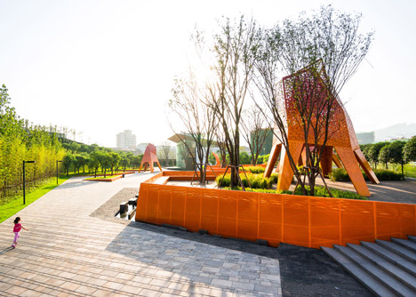 Four-legged perforated metal pavilions rise above Fengming Mountain Park
