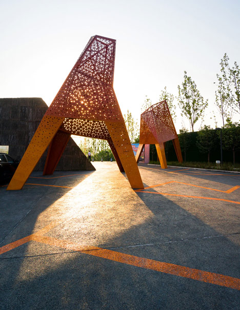Four-legged perforated metal pavilions rise above Fengming Mountain Park