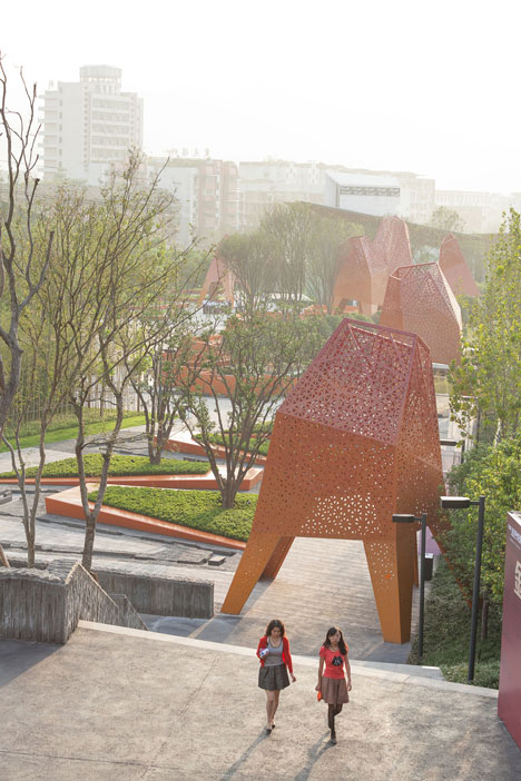Four-legged perforated metal pavilions rise above Fengming Mountain Park