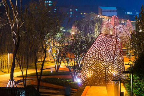 Four-legged perforated metal pavilions rise above Fengming Mountain Park