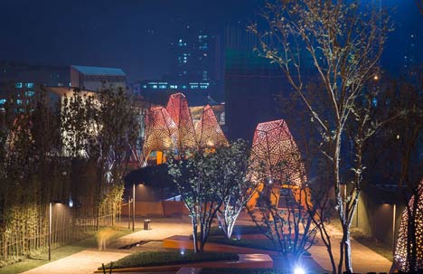 Four-legged perforated metal pavilions rise above Fengming Mountain Park