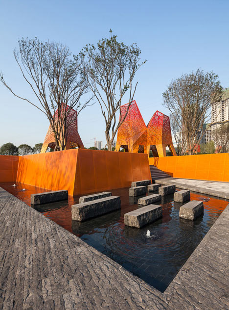 Four-legged perforated metal pavilions rise above Fengming Mountain Park