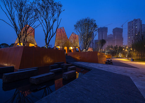 Four-legged perforated metal pavilions rise above Fengming Mountain Park