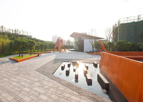 Four-legged perforated metal pavilions rise above Fengming Mountain Park