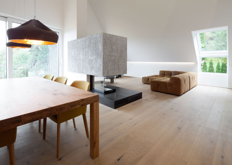 House B.A.B.E. by Destilat features windows dotted across shingle-clad facade