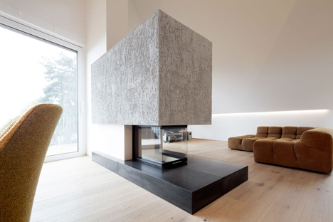 House B.A.B.E. by Destilat features windows dotted across shingle-clad facade