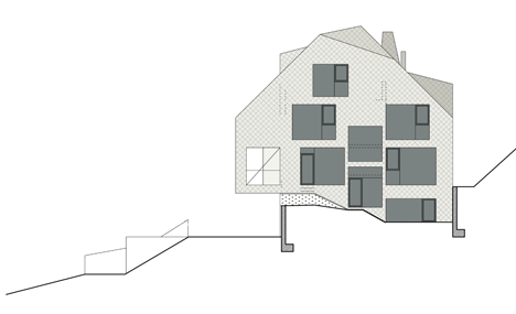 North east facade of House B.A.B.E. by Destilat features windows dotted across shingle-clad facade