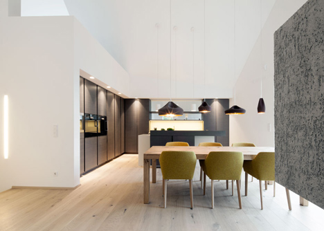 House B.A.B.E. by Destilat features windows dotted across shingle-clad facade