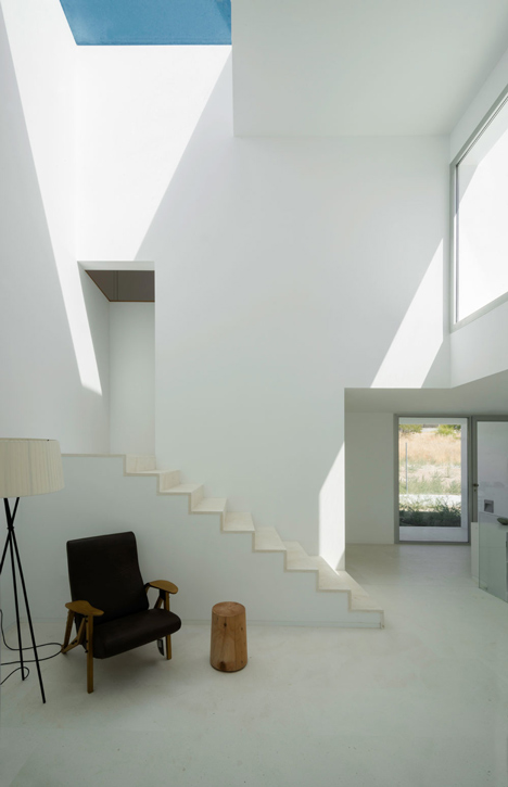 Casa H by Bojaus Arquitectura features a facade covered in holes