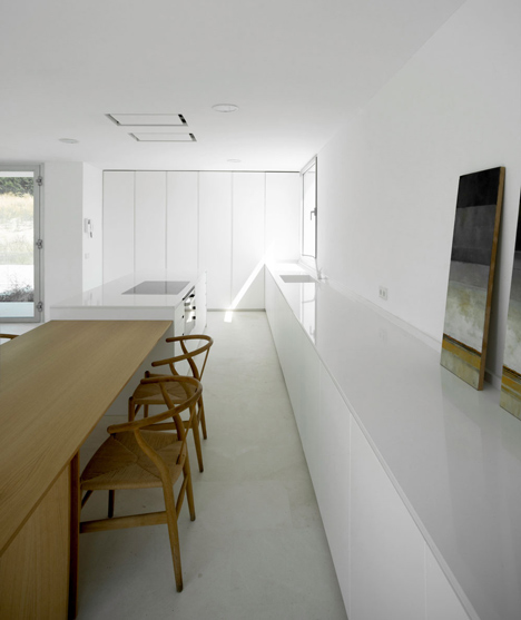 Casa H by Bojaus Arquitectura features a facade covered in holes