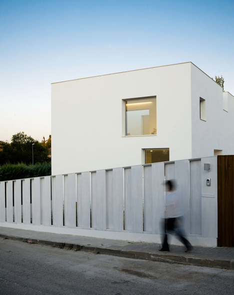 Casa H by Bojaus Arquitectura features a facade covered in holes
