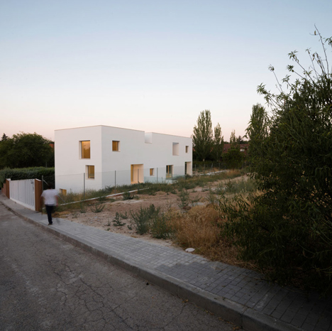 Casa H by Bojaus Arquitectura features a facade covered in holes