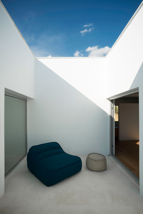 Casa H by Bojaus Arquitectura features a facade covered in holes