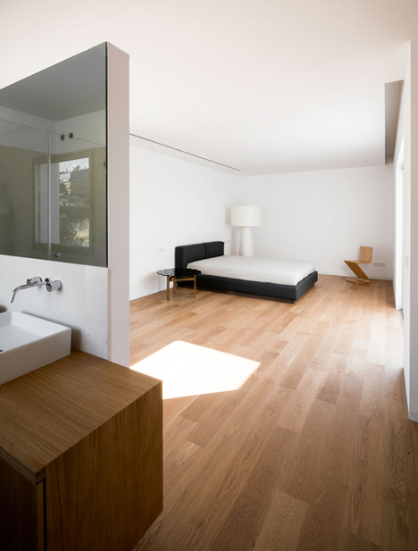 Casa H by Bojaus Arquitectura features a facade covered in holes