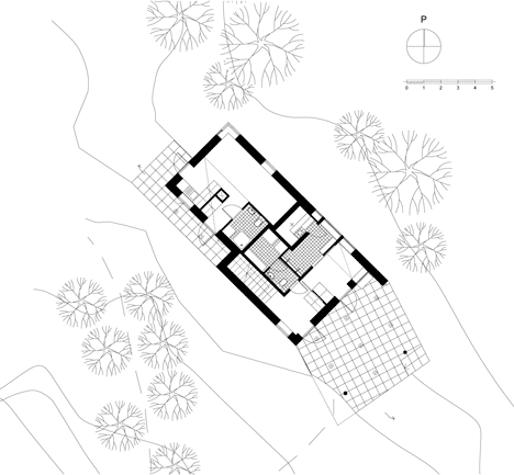 Timber-clad House M-M by Tuomas Siitonen wraps around a sheltered garden