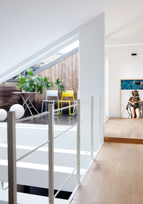 Floating steel staircase divides Haptic's Idunsgate Apartment in Oslo