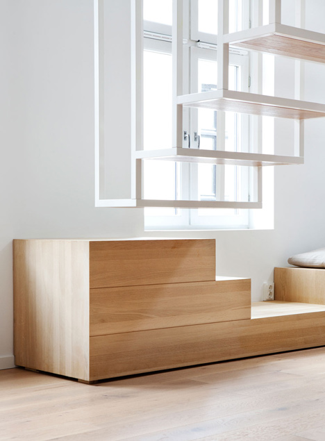 Floating steel staircase divides Idunsgate Apartment by Haptic