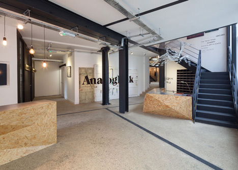 Industrial-style offices by DH Liberty mix reclaimed objects with minimal aesthetic