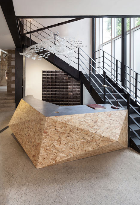 Industrial-style offices by DH Liberty mix reclaimed objects with minimal aesthetic