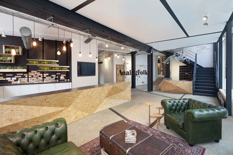 Industrial-style offices by DH Liberty mix reclaimed objects with minimal aesthetic