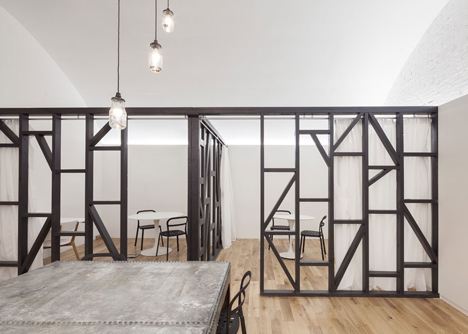 Industrial-style offices by DH Liberty mix reclaimed objects with minimal aesthetic