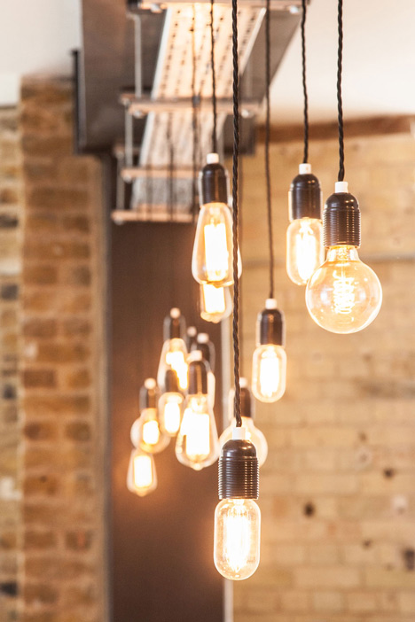 Industrial-style offices by DH Liberty mix reclaimed objects with minimal aesthetic