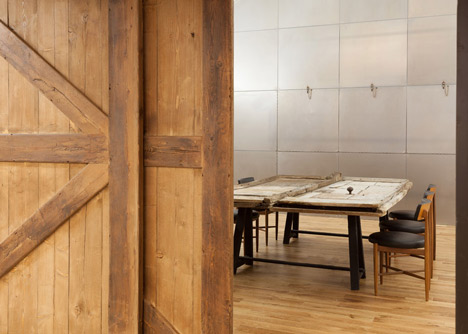Industrial-style offices by DH Liberty mix reclaimed objects with minimal aesthetic