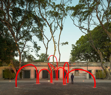 Luminous red arches by LIKEarchitects installed at Portuguese palace