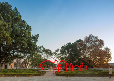 Luminous red arches by LIKEarchitects installed at Portuguese palace