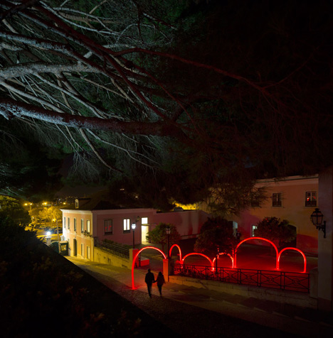 Luminous red arches by LIKEarchitects installed at Portuguese palace