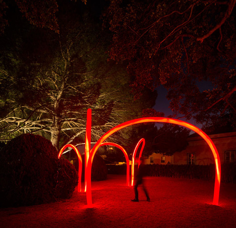 Luminous red arches by LIKEarchitects installed at Portuguese palace