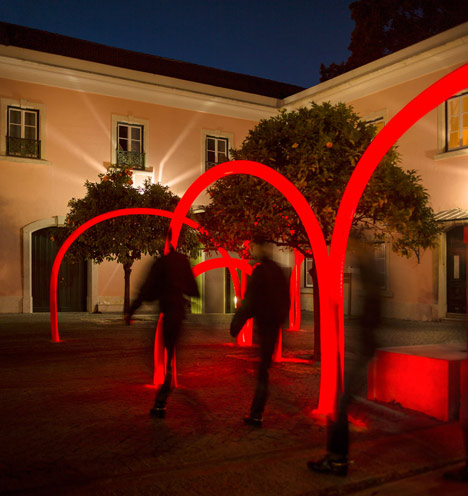 Luminous red arches by LIKEarchitects installed at Portuguese palace