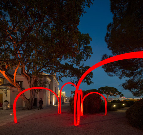 Luminous red arches by LIKEarchitects installed at Portuguese palace