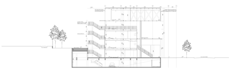 Long section of Shiny metal box hovers above shopping and restaurant complex by Triptyque