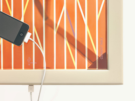 The Current Table by Marjan van Aubel features a solar panel for charging mobile phones