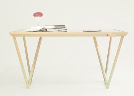 The Current Table by Marjan van Aubel features a solar panel for charging mobile phones