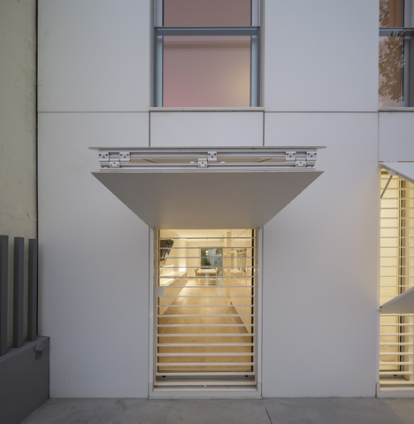 Parede 11 house by Humberto Conde has hinged protective panels