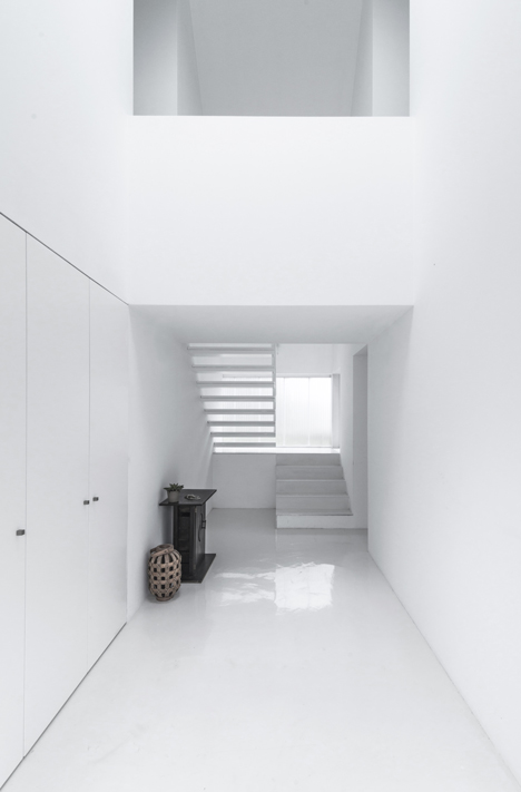 White buildings sink into the landscape at the White Wolf Hotel by AND-RÉ