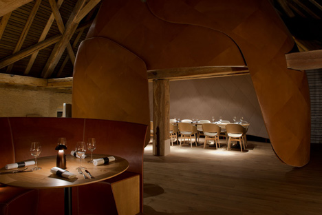 Wooden strips coil around staircase at Strasbourg hotel by Jouin Manku