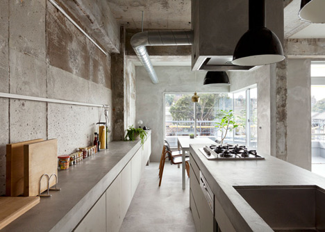 Bare concrete apartment by Airhouse Design Office presents its own fashion exhibitions